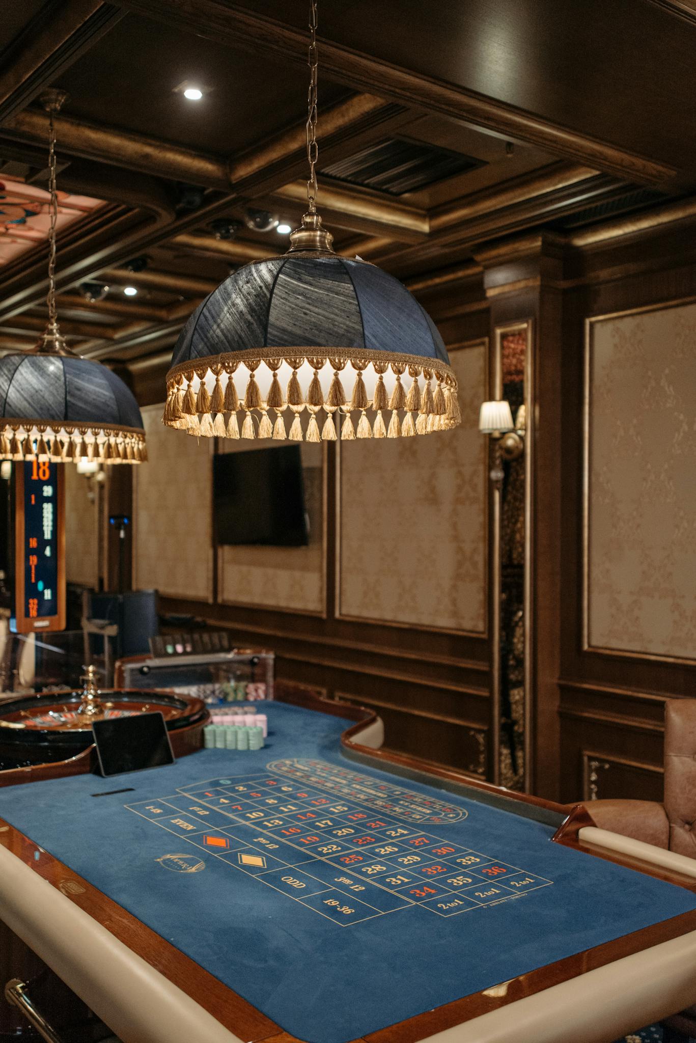 Elegant casino setting showcasing a roulette table and ambient lighting.